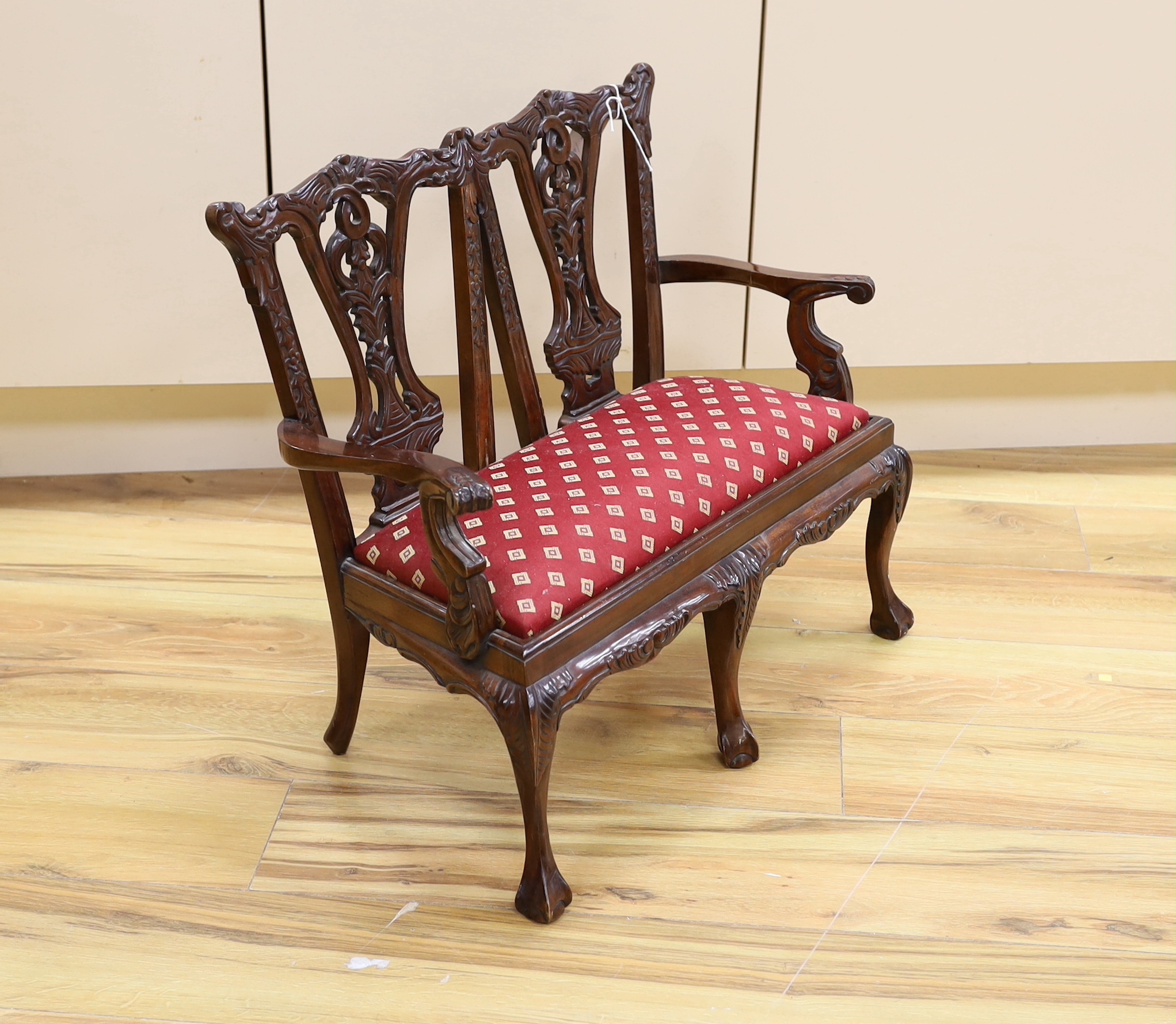 A miniature Chippendale style chair back settee, 51.5cm high